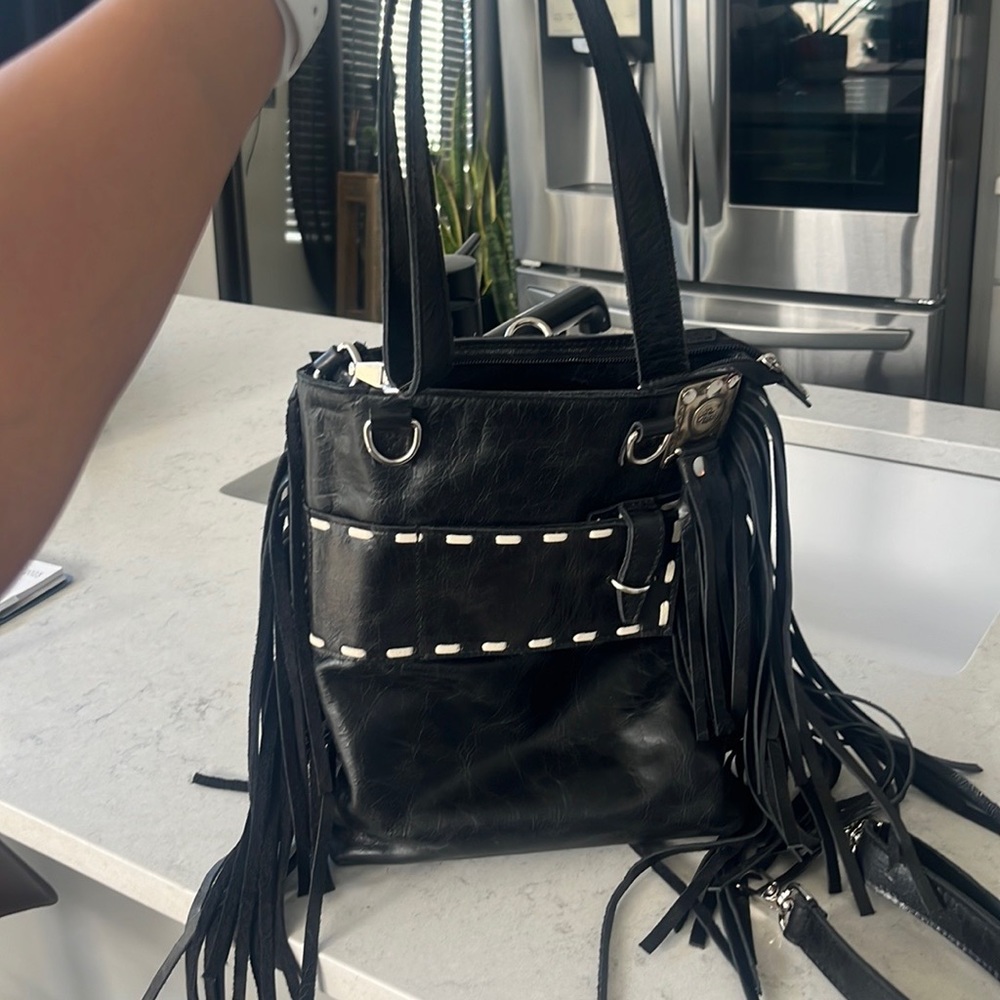 Pure Dixie multiple usage bag! This has many different ways to use this bag!